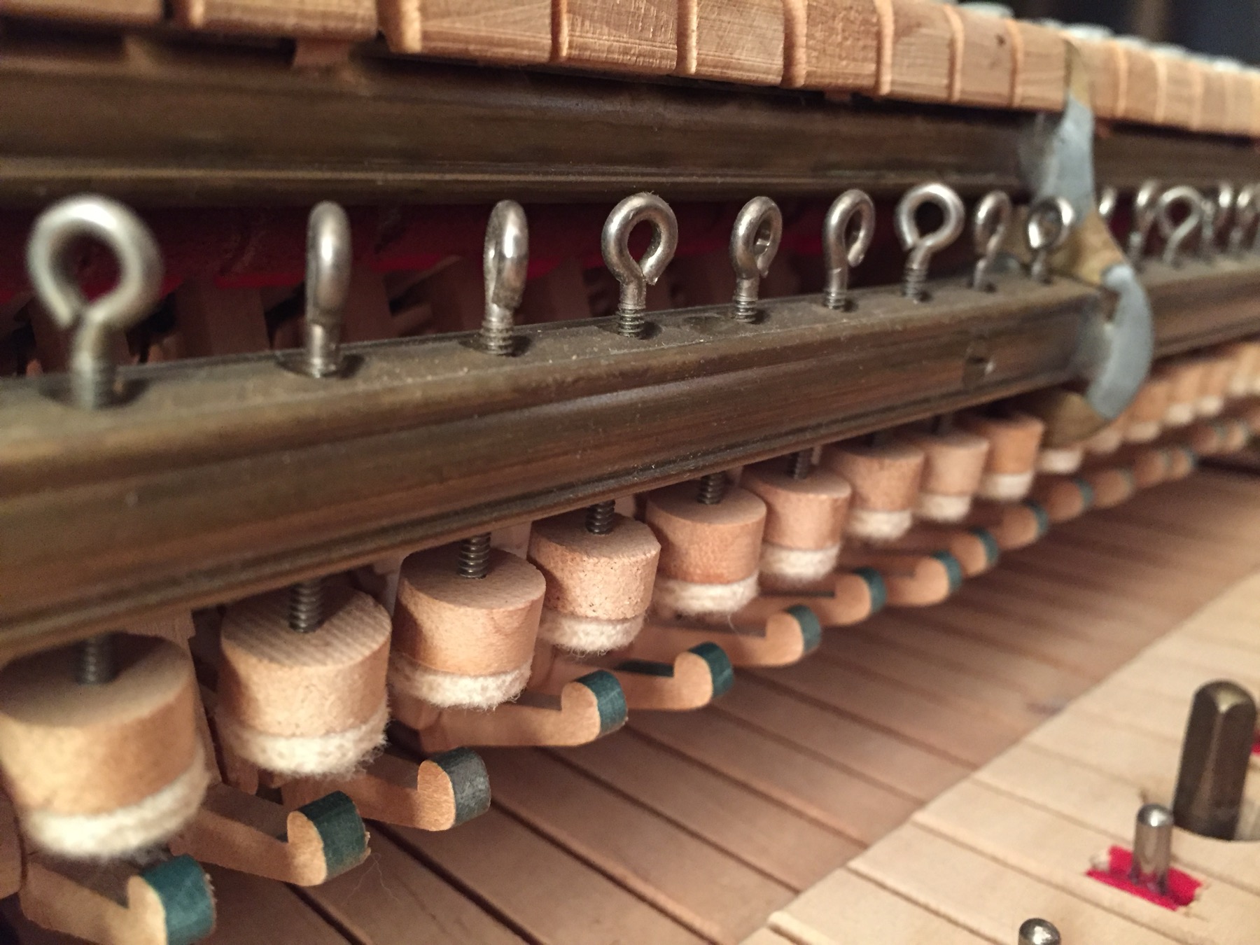 Open upright piano with action and keys exposed