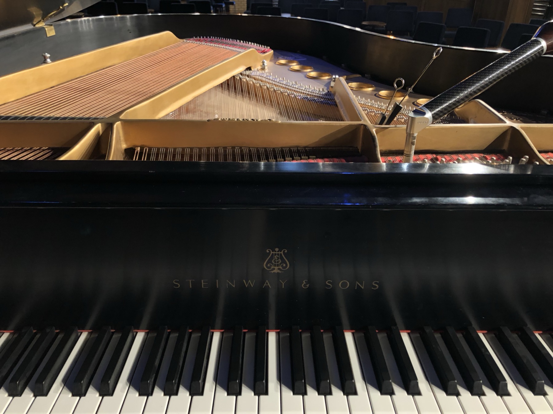 Grand piano with tuning lever inside